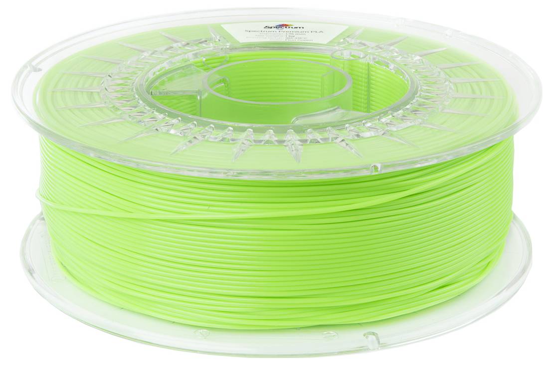Bobine de filament pour imprimante 3D de couleur verte, enroulée uniformément sur un support en plastique transparent. Idéal pour l'impression 3D.