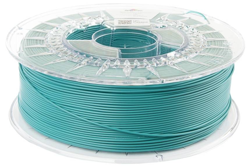 Une bobine de filament turquoise pour imprimante 3D, soigneusement enroulée dans un support en plastique transparent.