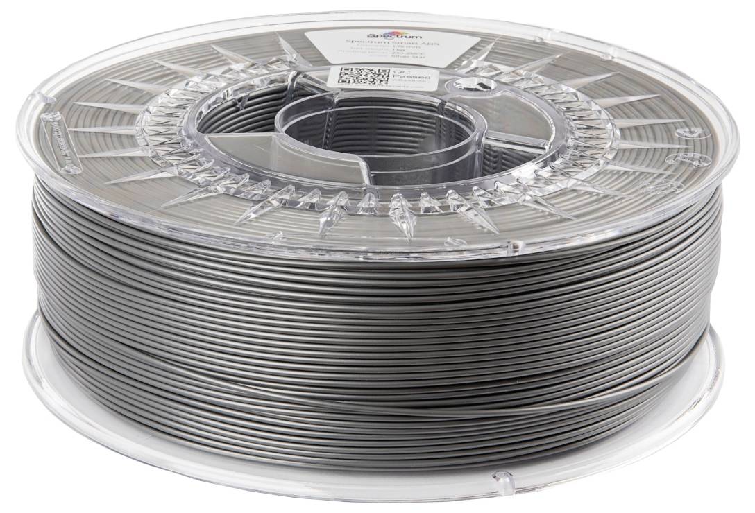 Bobine de filament en plastique gris pour imprimante 3D.