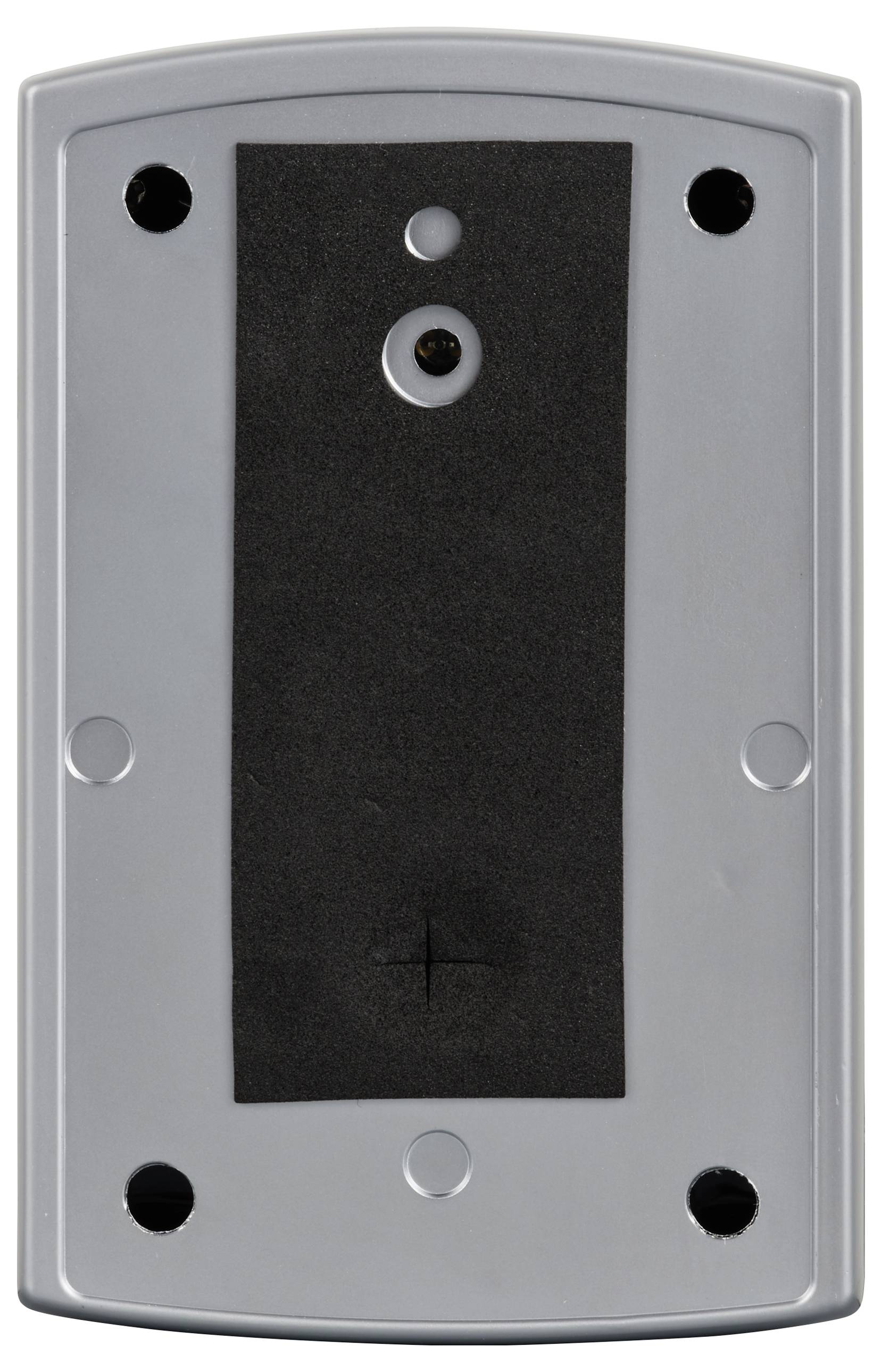 Un appareil rectangulaire gris avec six découpes rondes aux coins et au centre, connecteur de câble en haut et symbole en croix en bas.