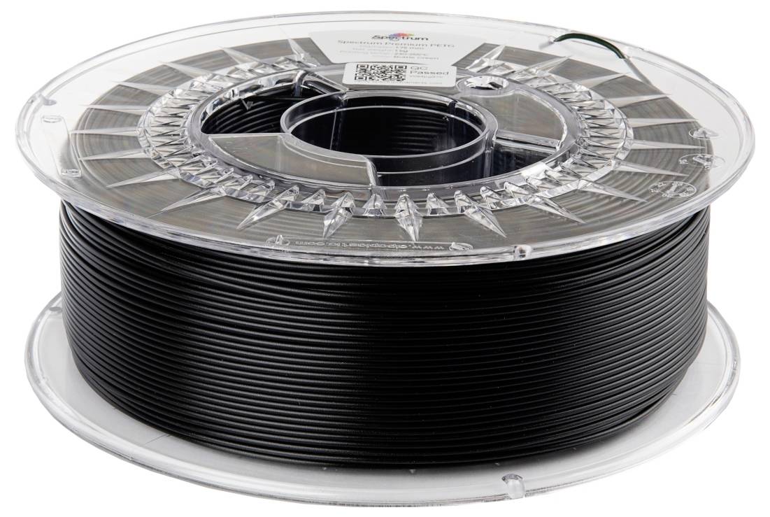 Bobine de filament noir pour imprimante 3D dans un emballage en plastique transparent.