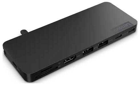 Un hub USB-C noir et rectangulaire de Lenovo avec plusieurs ports, dont HDMI, USB-A et USB-C, posé sur une surface blanche.