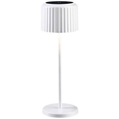 Lampe de table blanche et haute, avec un abat-jour nervuré et une base circulaire.