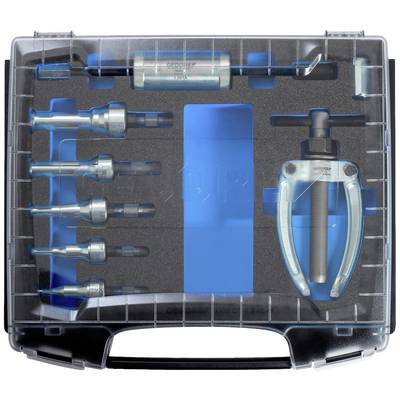 Une boîte à outils contenant différents embouts et un extracteur, soigneusement rangés dans des compartiments prédéfinis.