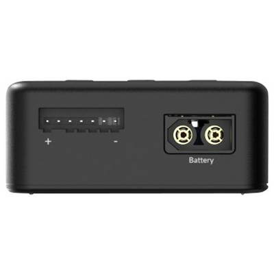 Un compartiment de batterie noir avec deux bornes, l'une marquée '+' et '-', et l'autre portant l'inscription 'Battery'.