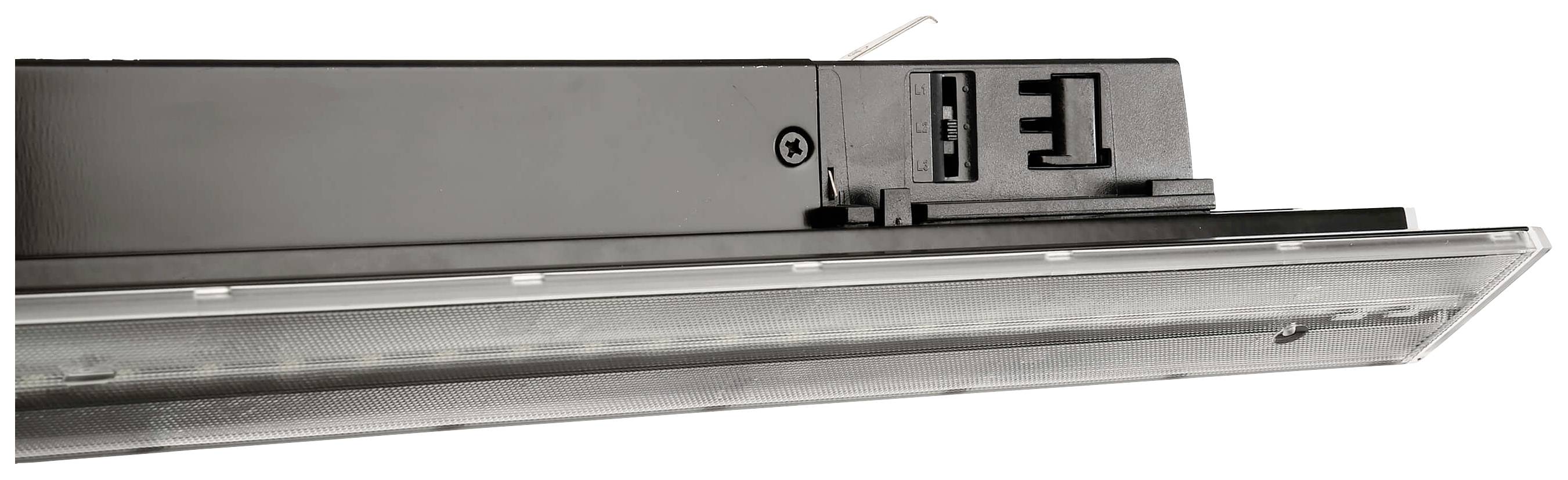 Unité d'éclairage LED dans un boîtier noir, visible du dessous, avec un écran transparent et des points de connexion apparents.