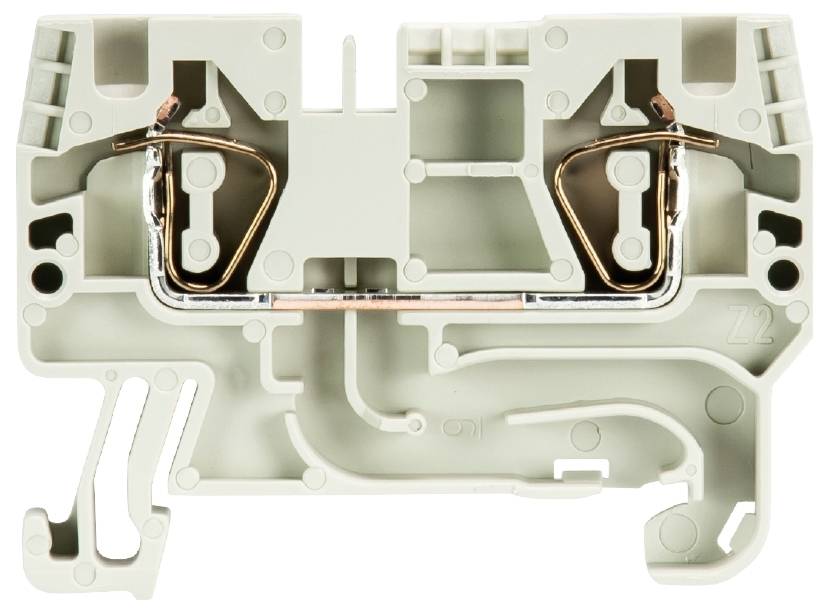 Pièce rectangulaire grise en plastique avec des contacts métalliques et des cavités. Il s'agit d'une borne électrique.