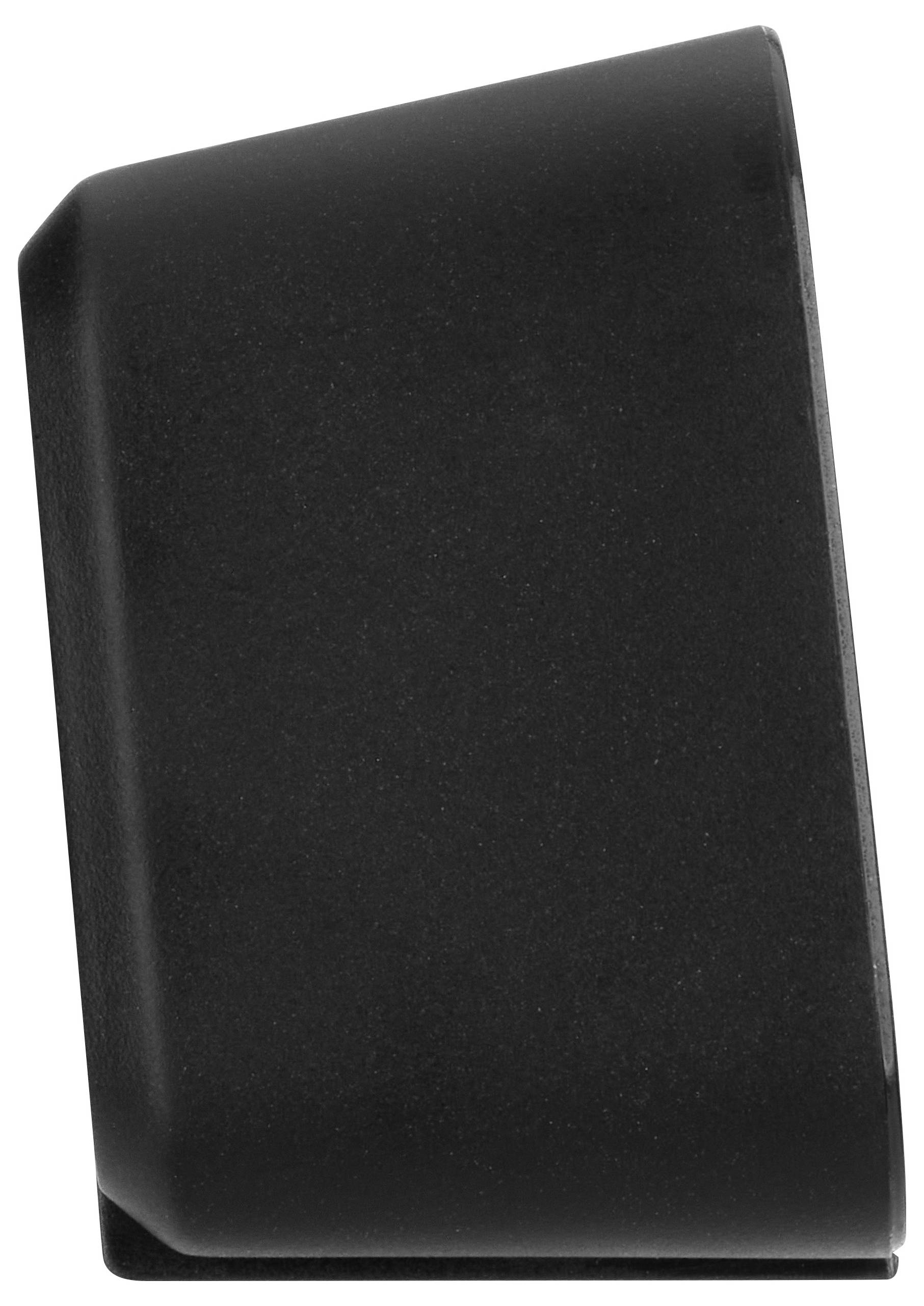 Un objet noir, arrondi, rectangulaire avec un dessus biseauté.