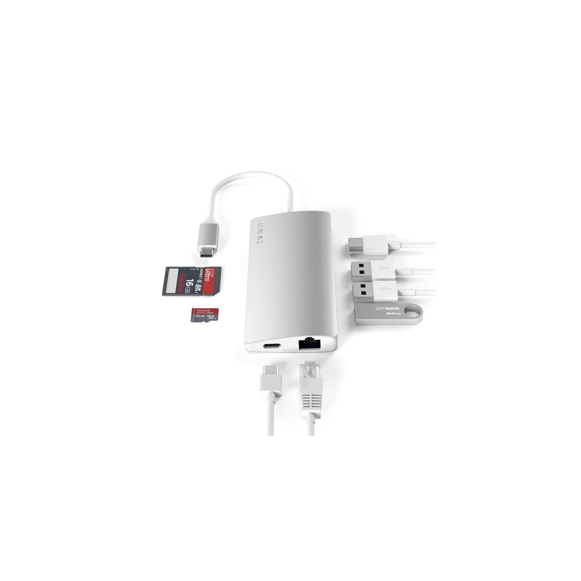 Un adaptateur USB multiport argenté avec différents ports : Ethernet, lecteur de carte SD, USB et HDMI. Sur un fond blanc.
