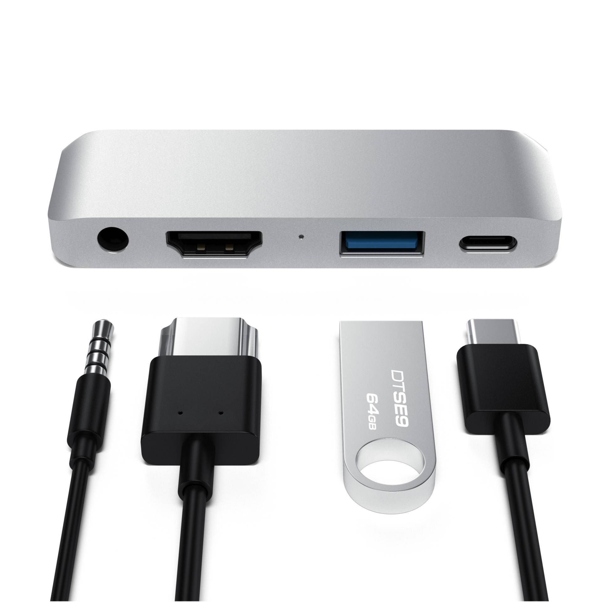 Un hub USB-C avec ports : HDMI, USB-A, USB-C et jack 3,5 mm. Comprend des adaptateurs pour jack 3,5 mm, adaptateur USB et clé USB.