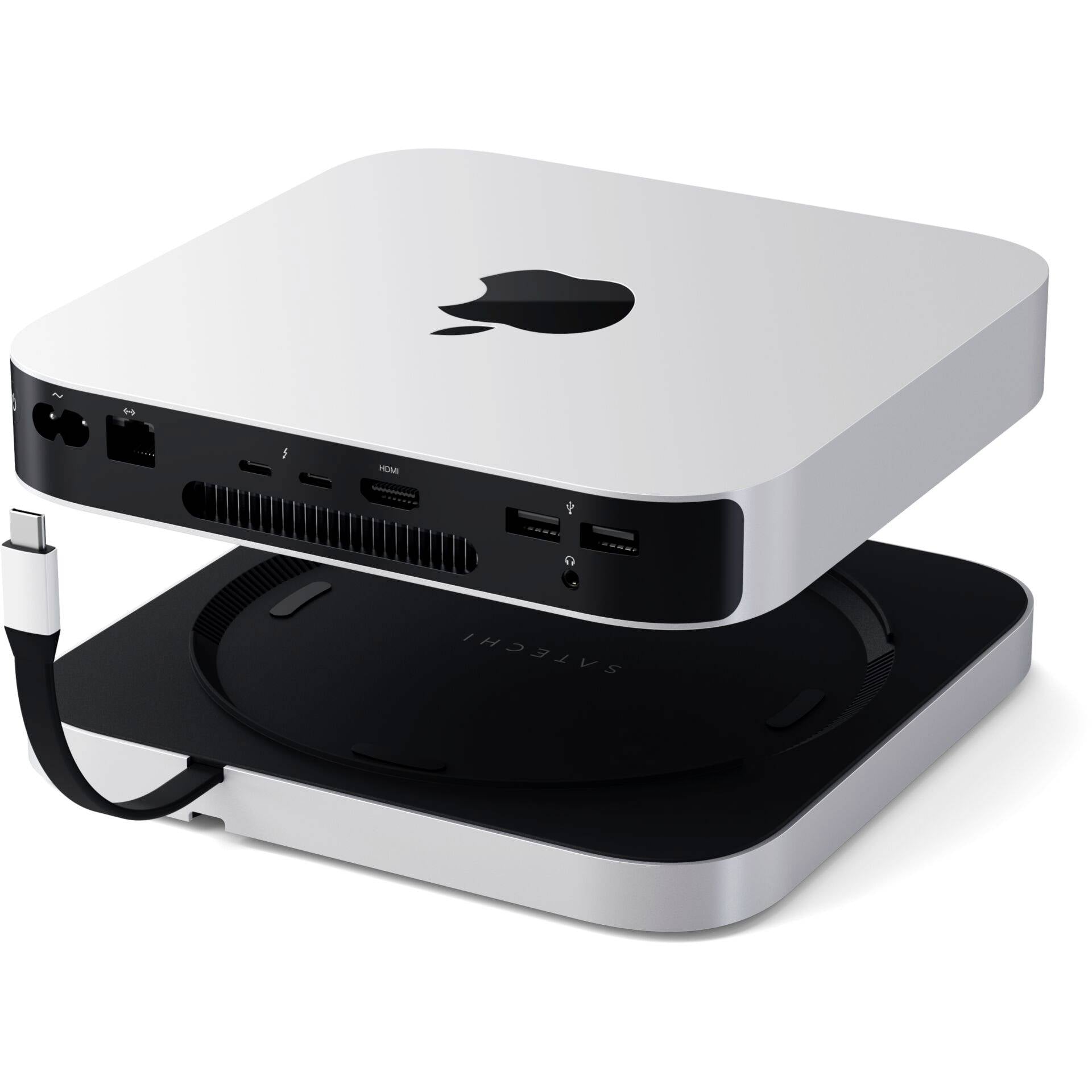 Un petit ordinateur argenté avec le logo Apple, différents ports et un câble à l'arrière.