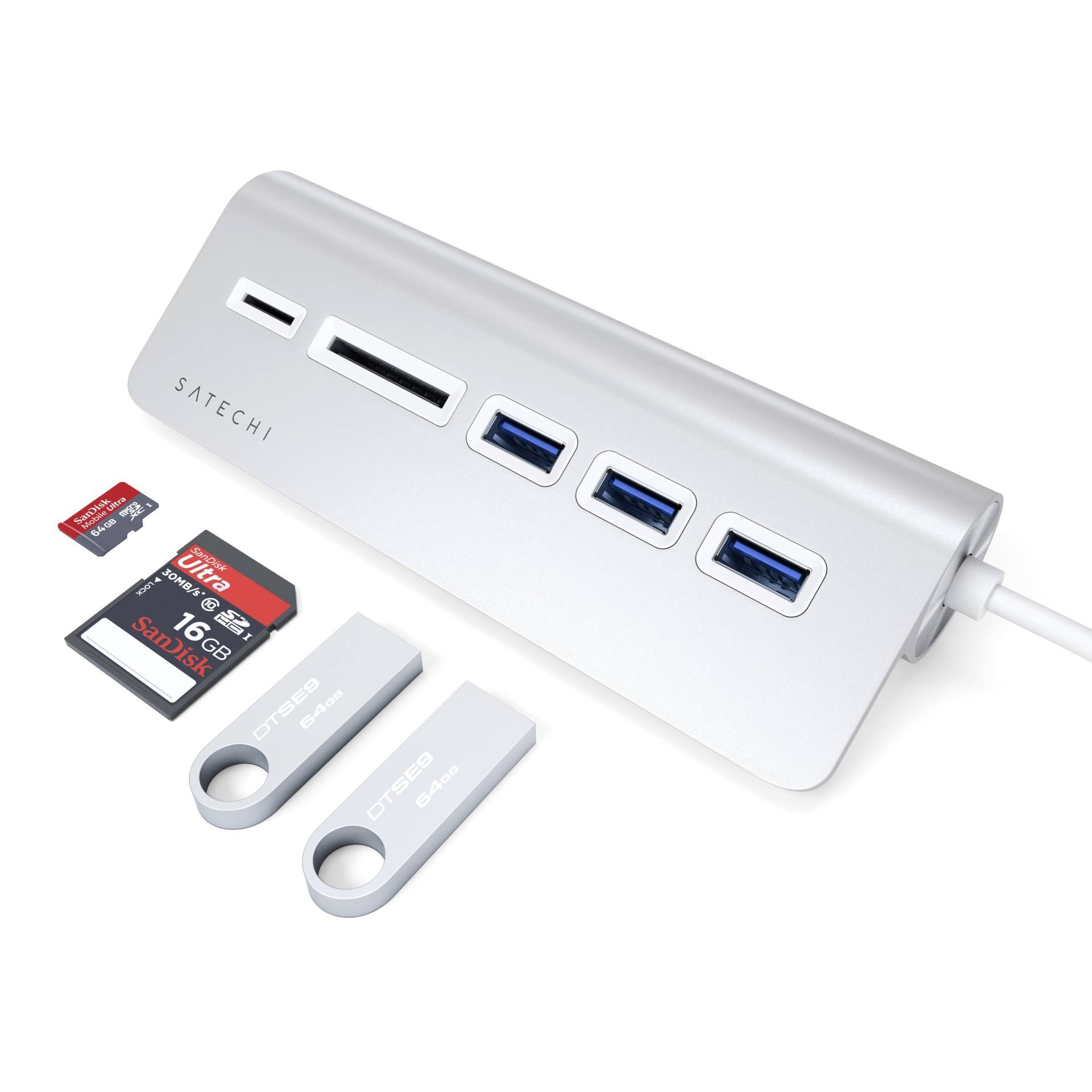 Hub USB avec trois ports USB, un lecteur de carte SD et deux clés USB. Cartes SD de 8 Go et 16 Go placées à côté.