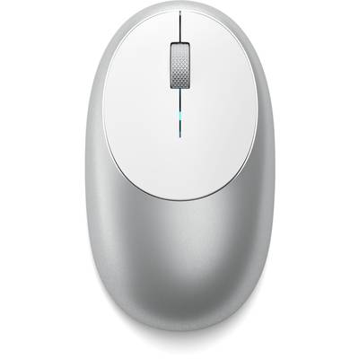 Une souris d'ordinateur sans fil argentée avec une molette de défilement centrale sur une surface blanche et lisse.