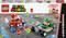 Ensemble LEGO Super Mario 'Bébé Mario contre Bébé Luigi'. Représente Bébé Mario et Bébé Luigi dans leurs karts de course avec des accessoires colorés. Comprend 321 pièces. À partir de 8 ans.