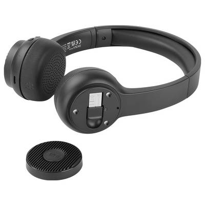 Casque noir sans fil avec des écouteurs amovibles et un chargeur en dessous.