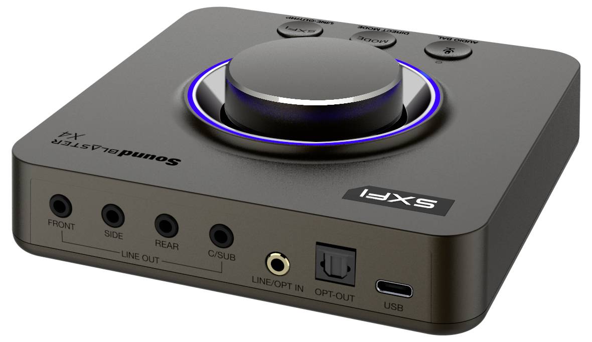 Un amplificateur audio gris avec un bouton de volume rétroéclairé en bleu, plusieurs entrées audio et un port USB à l'avant.
