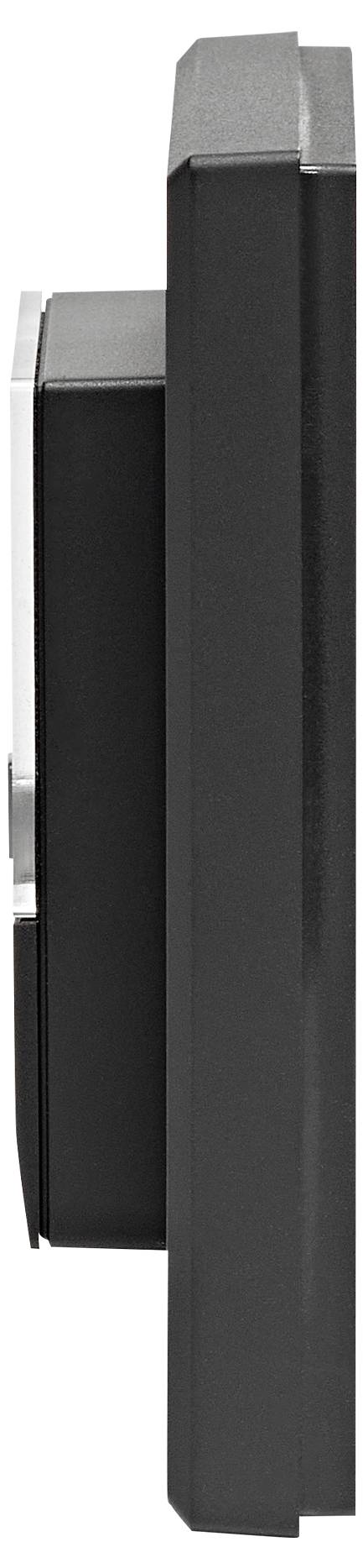 Objet noir, rectangulaire, plat, avec un profil étroit et une fente verticale sur le côté gauche, probablement un appareil électronique.