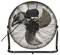 Grand ventilateur noir à trois pales avec grille de protection, monté sur un support métallique simple. Le câble électrique est visible sur le côté gauche.