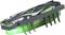 Un petit insecte artificiel luminescent vert, avec six pattes et un motif décoratif sur son dessus, se tient sur un support.