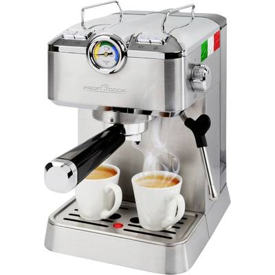Machine à espresso en argent avec manomètre, deux tasses blanches sur le plateau égouttoir. Café fraîchement préparé, vapeur s'élevant.