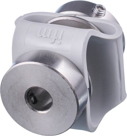 Une pièce mécanique cylindrique en argent avec un intérieur noir, montée sur un support gris.