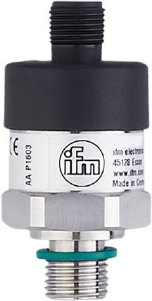 Un dispositif circulaire avec une étiquette blanche portant le logo 'ifm' et des informations de production. Il semble s'agir d'un composant de capteur industriel.