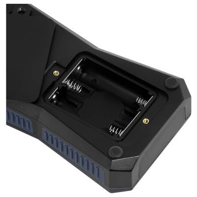 Socle de recharge noir avec un logement de batterie vide, des contacts à ressort et des accents latéraux bleus, vu de dessus sur un fond blanc.