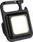 Décapsuleur LED noir avec lumière carrée au centre et support de bouteille en haut. Idéal pour le camping ou les fêtes.
