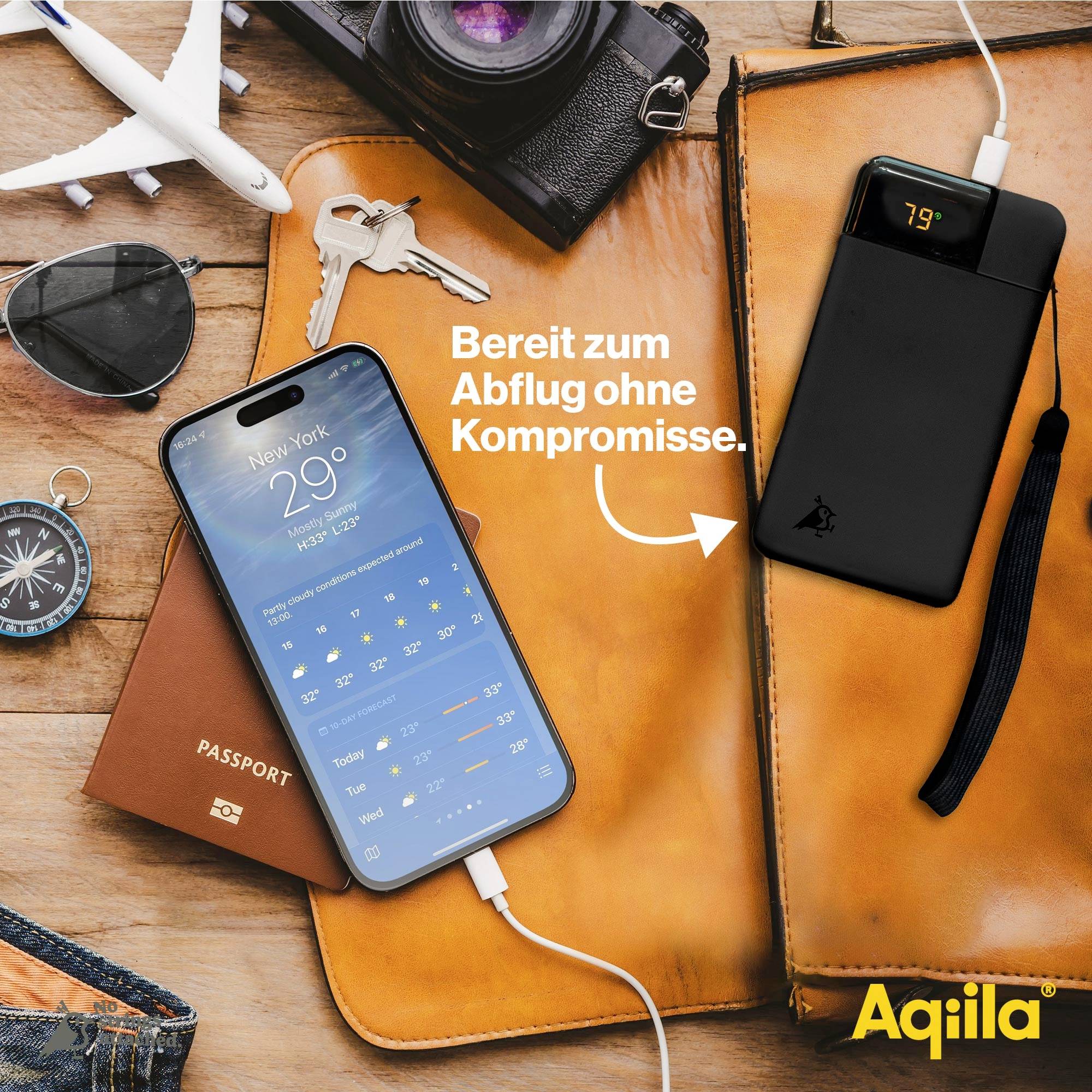 Voici la traduction en français :<br><br>'Smartphone affiche la prévision météorologique. Batterie externe recharge le téléphone. Texte : Prêt au départ sans compromis. Nom de marque : Aqilla.'