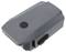Batterie grise pour drones, de forme rectangulaire, avec un bouton et quatre voyants LED indiquant le niveau de charge.