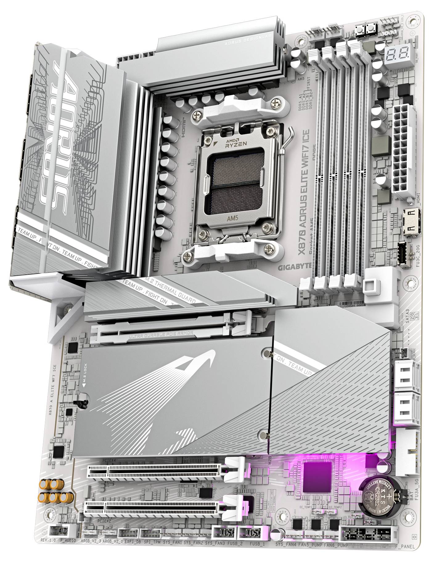 Une carte mère argentée portant l'inscription 'AORUS' avec un éclairage RVB, comportant plusieurs emplacements pour RAM et un socket CPU au centre.