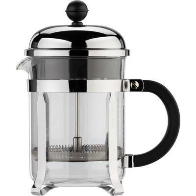 Cafetière française en verre et métal, avec une poignée noire. Elle possède un bouton rond sur le dessus du couvercle.