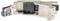 Un connecteur RJ45 modulaire avec son boîtier métallique ouvert et une clé de codage couleur pour le câblage T568B est posé devant.