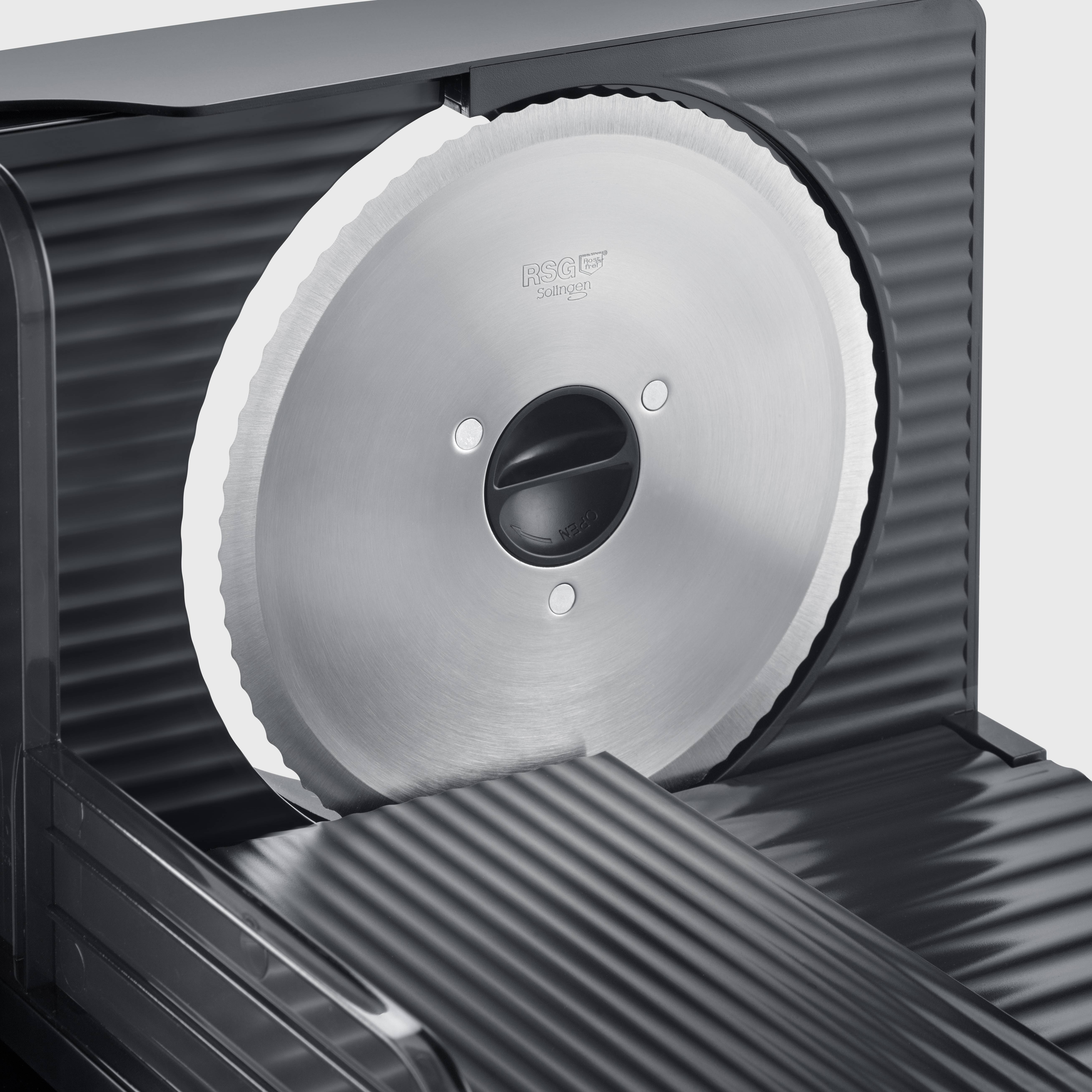 Machine à découper électrique avec lame circulaire en métal et surface cannelée, adaptée pour couper des aliments.