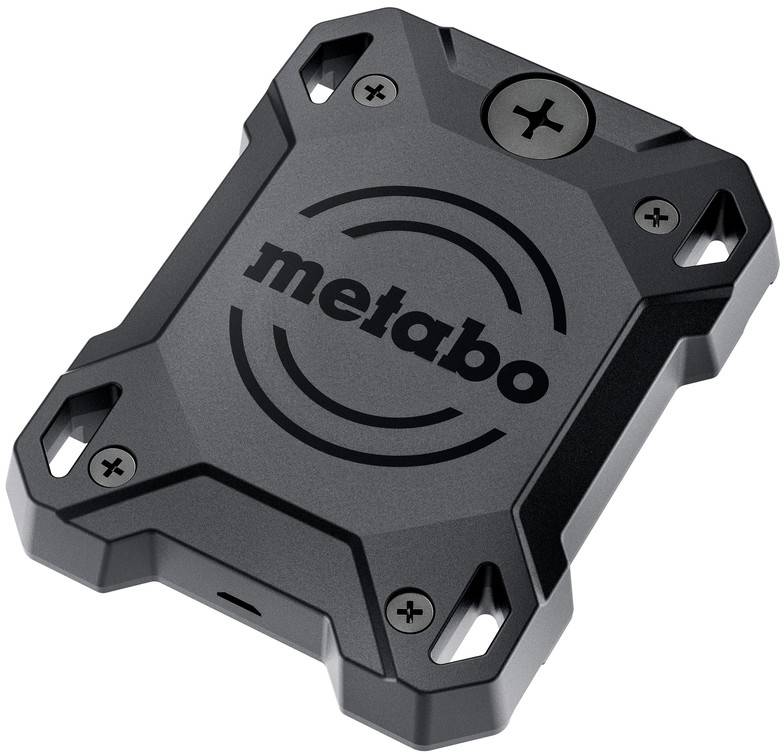 Couvercle de dispositif carré de marque Metabo gris foncé avec quatre trous de vis aux coins, présenté sur un fond blanc.