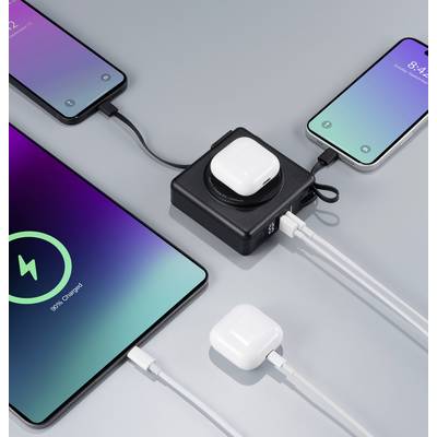 Plusieurs smartphones et AirPods sont branchés sur un chargeur qui alimente tous les appareils simultanément. États de charge différents.