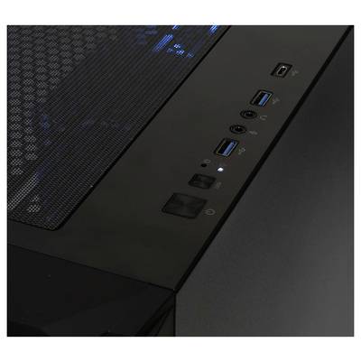 Boîtier d'ordinateur noir vu de dessus, montrant une interface avec plusieurs ports USB et un interrupteur d'alimentation lumineux.