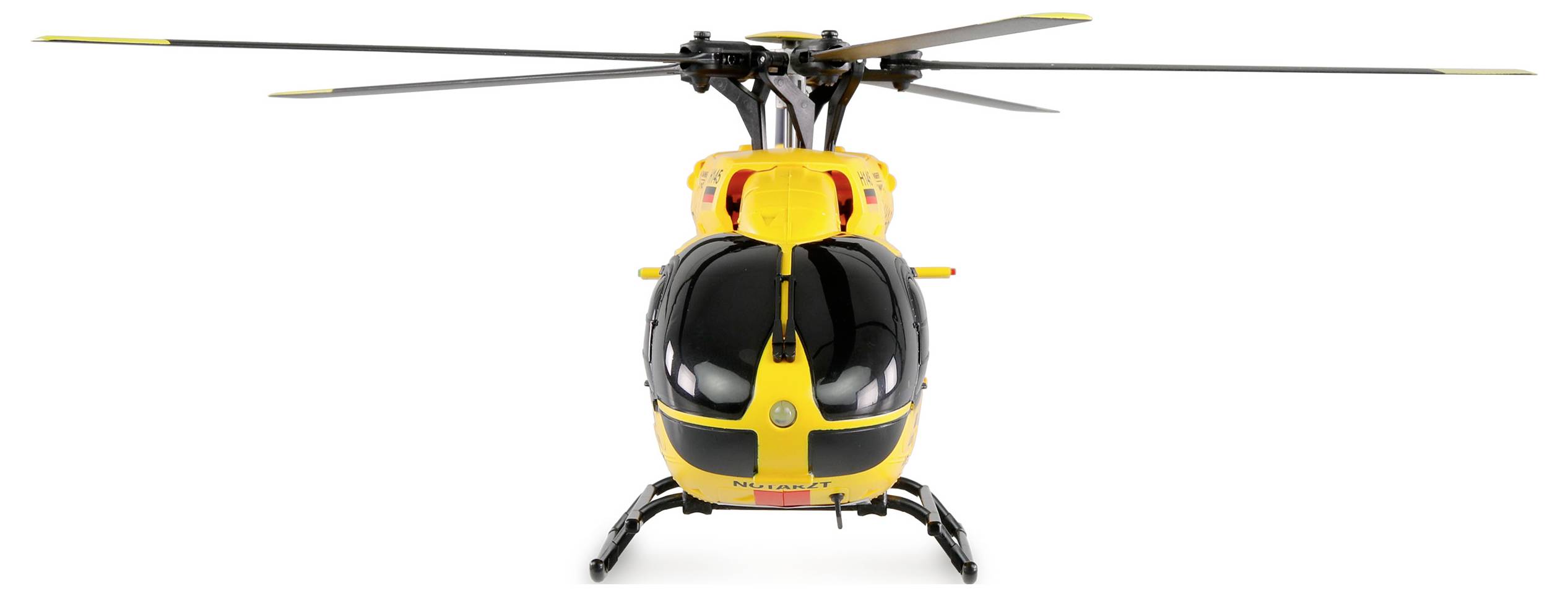 Hélicoptère de secours jaune photographié de face, montrant ses pales de rotor et son cockpit, prêt pour des missions médicales d'urgence.