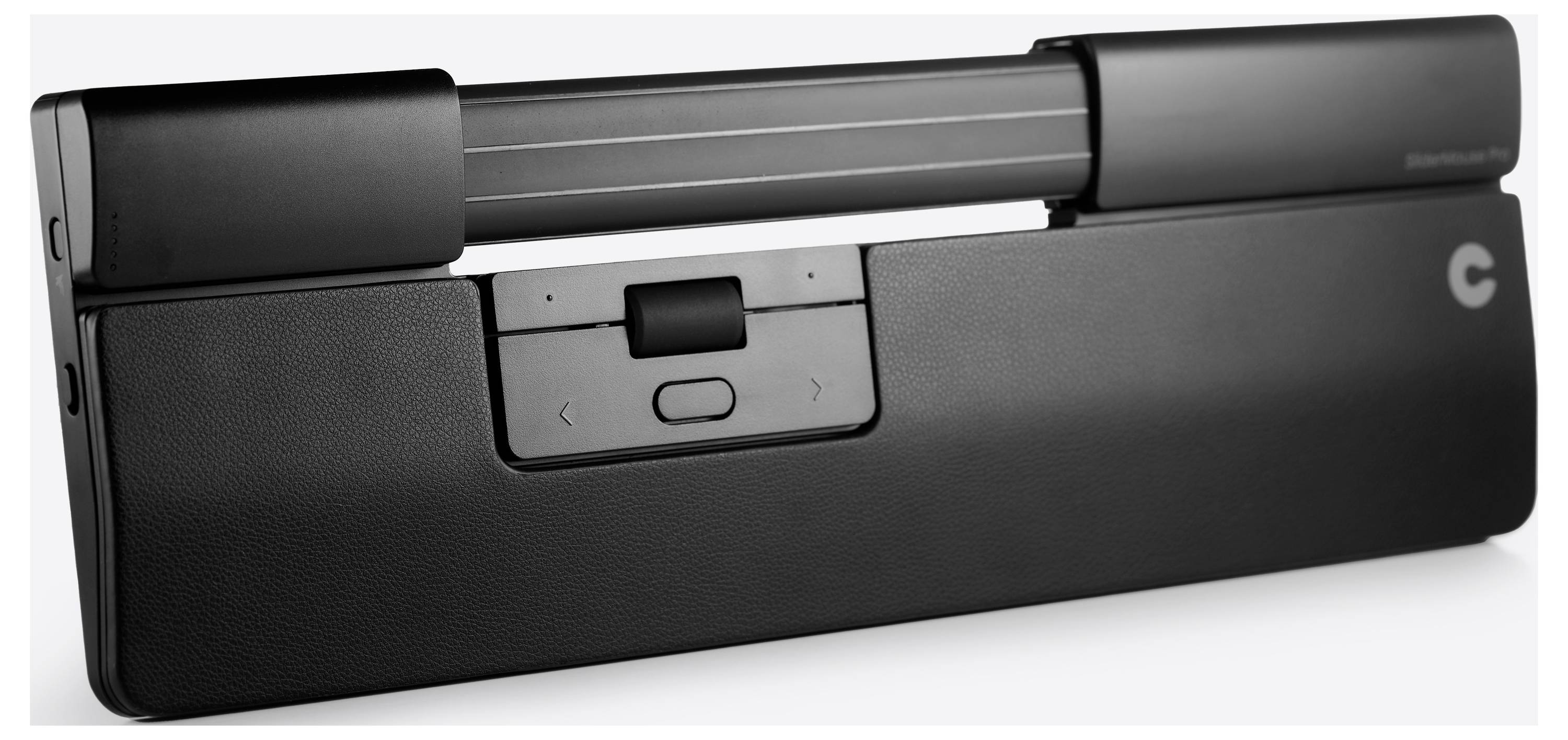 Une accessoire informatique noire, rectangulaire, avec un bouton central, deux touches fléchées et un mécanisme de défilement sur le dessus.