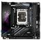 Une carte mère AORUS noire avec socket CPU, emplacements RAM et ports USB. Design distinctif arborant un logo vert et violet.