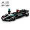 Modèle de voiture de course Lego noir avec inscription 'Petronas' et accents rayés. Comprend 267 pièces et une minifigurine avec un casque.