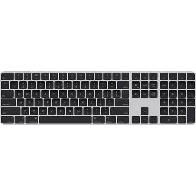 Clavier d'ordinateur noir avec disposition allemande ; comprend le pavé numérique, les touches de fonction et les touches fléchées sur un fond gris.
