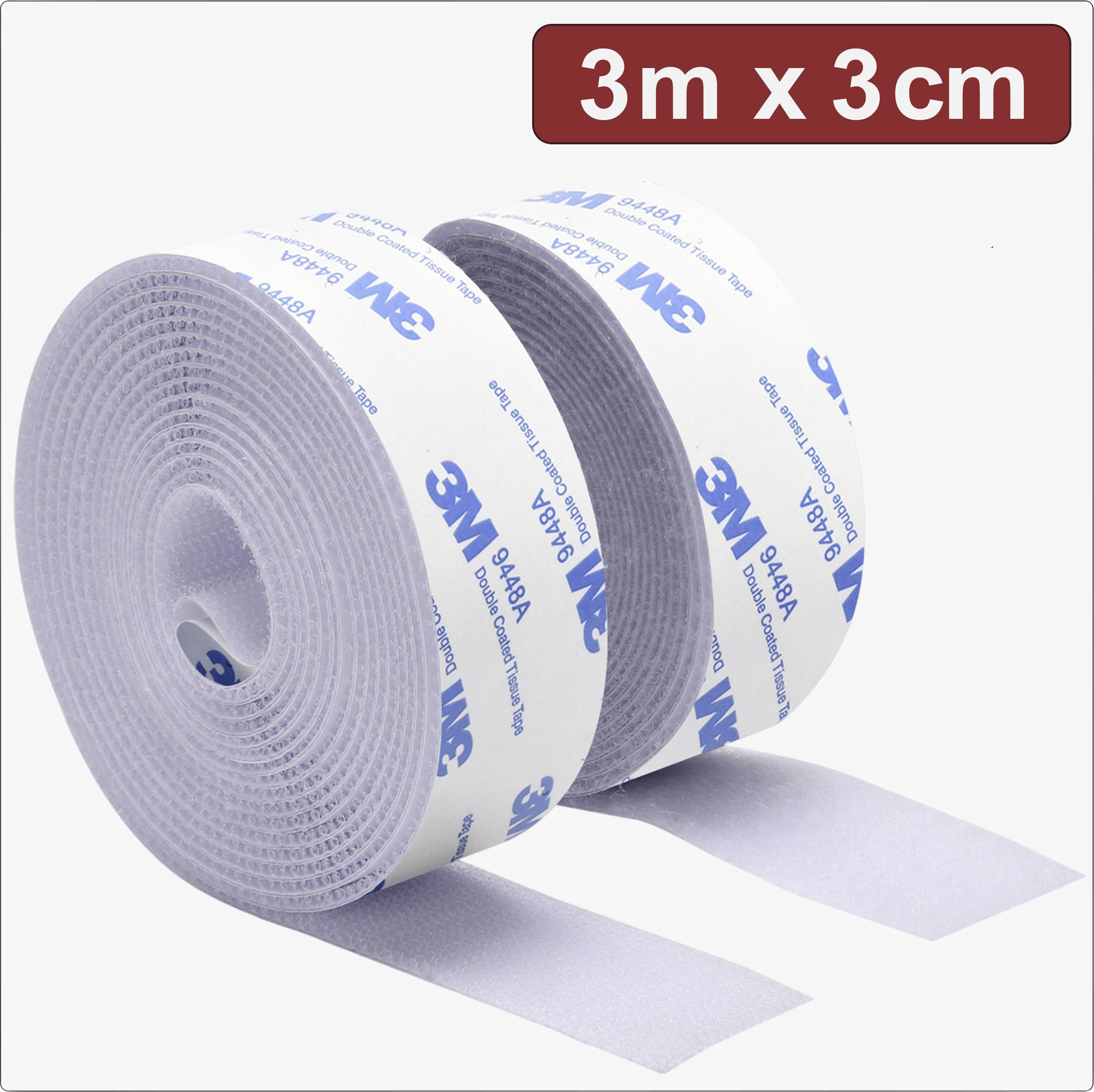 Deux bandes auto-agrippantes blanches portant l'inscription bleue '3M'. En haut à droite est inscrit '3m x 3cm'. L'une des bandes est partiellement déroulée.