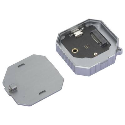 Un boîtier électronique ouvert, rectangulaire, avec son couvercle retiré, révèle des connexions internes et une carte électronique noire.