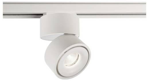 Un projecteur cylindrique blanc est fixé sur un rail et éclaire vers le bas.