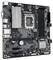Une carte mère noire avec différents ports et un emplacement pour processeur (CPU) au centre.