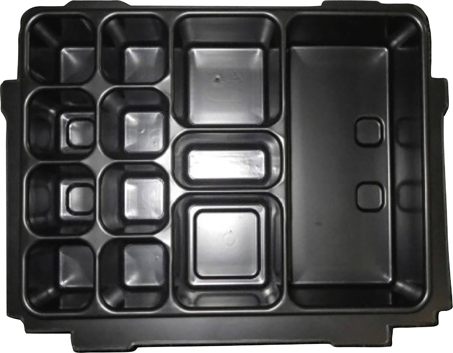 Boîte multifonction en plastique noir avec plusieurs cavités rectangulaires et carrées pour le rangement ou l'organisation.