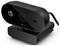 Webcam HP noire sur un support avec un câble, l'objectif et un voyant rouge sont visibles.