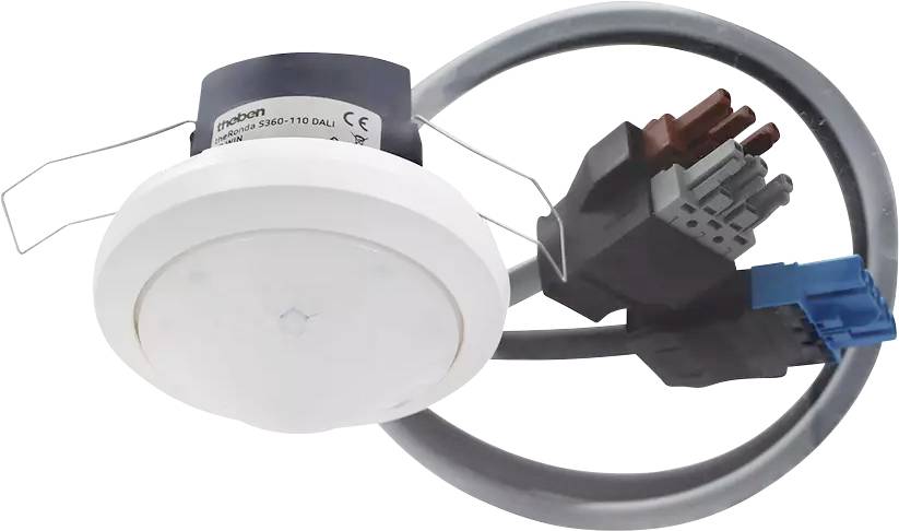Un détecteur de mouvement de plafond avec connexions par câbles. Le capteur est rond et blanc, relié à plusieurs câbles.