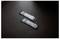 Deux SSD M.2 sont posés côte à côte sur une surface sombre, affichant leurs spécifications techniques et leurs logos de marque sur le dessus.